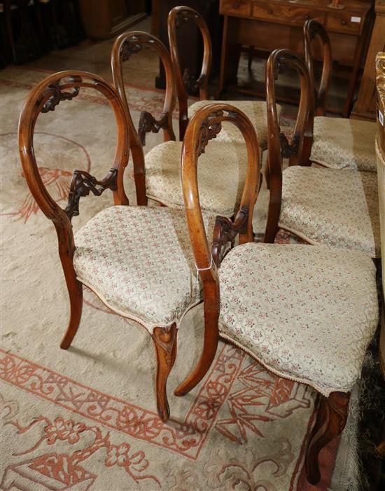 A set of spoon-back Victorian walnut salon chairs